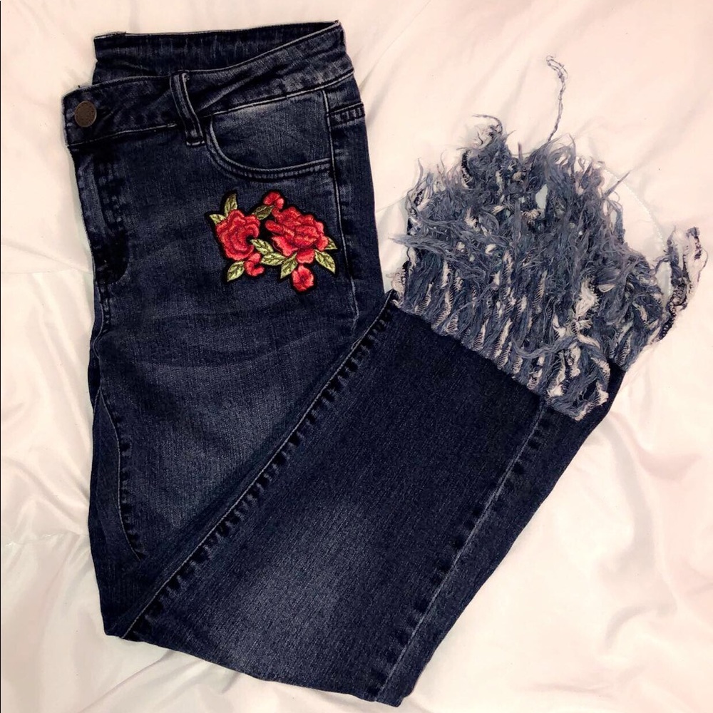 Jeans with Rose patches and fringed bottoms